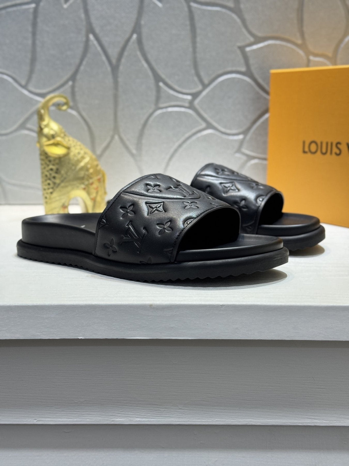 Louis Vuitton Embossed Slide Sandals — front